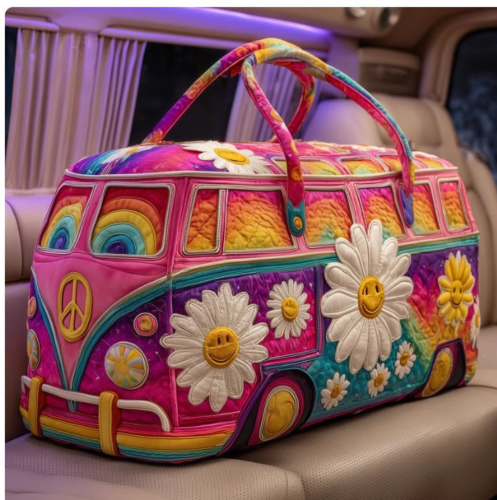 Cleota | Quilted Weekend Bag — quilted duffle bag with a retro camper van design, hot pink body with white daisies and teal detailing