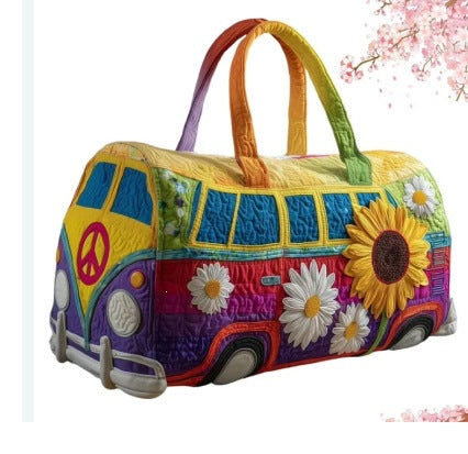 Elvera | Quilted Weekend Bag — quilted duffle bag with a retro camper van design, blue front with deep red and yellow panels and one large sunflower