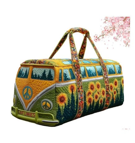 Fredonia | Quilted Weekend Bag — quilted duffle bag with a retro camper van design, golden yellow body with an olive peace sign, pine trees and sunflowers