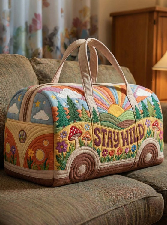 Willene | Quilted Weekend Bag — quilted duffle bag with a retro camper van design, cream body with a pastel sunrise scene and the words STAY WILD