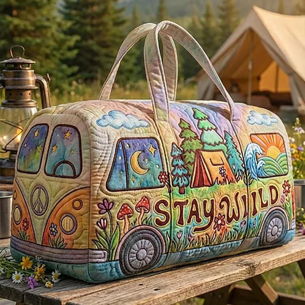 Althea | Quilted Weekend Bag — quilted duffle bag with a retro camper van design, cream body with a pastel camp scene and the words STAY WILD