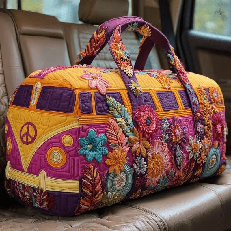 Oletha | Quilted Weekend Bag — quilted duffle bag with a retro camper van design, golden yellow body with a magenta front, teal blooms and a peace sign
